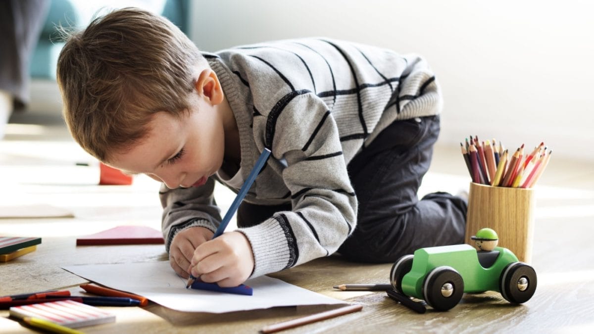 Child focused on drawing