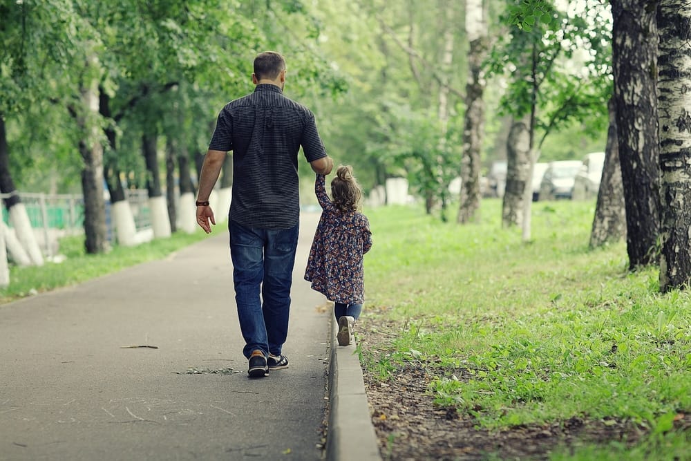 Dad walks with her daughter
