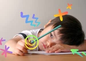 Bored child holding pen